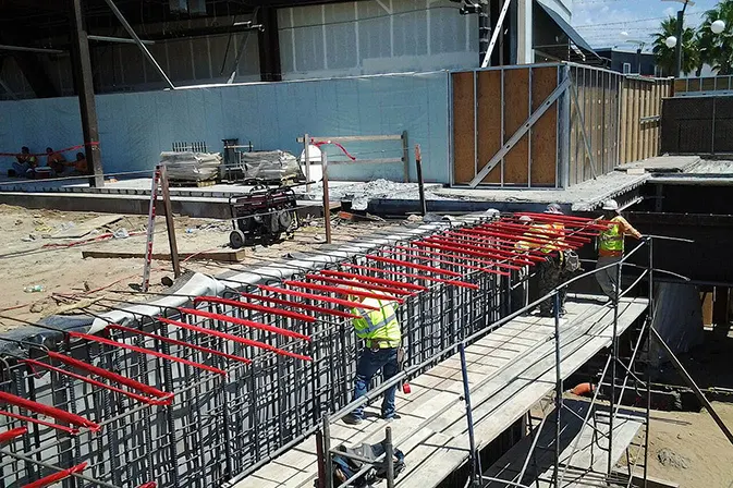 Angelus Waterproofing employees installing sheet membrane air barrier at Del Amo Mall, Lakewood, CA