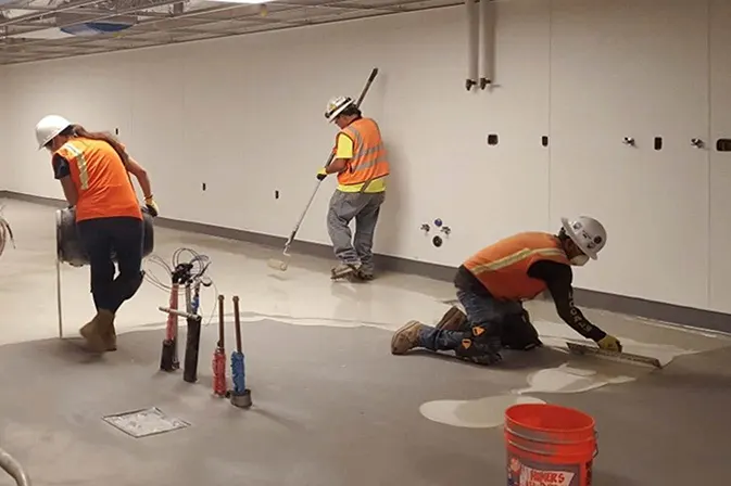 Angelus employees applying food grade resinous flooring at Pechanga Resort Casino, San Diego County CA